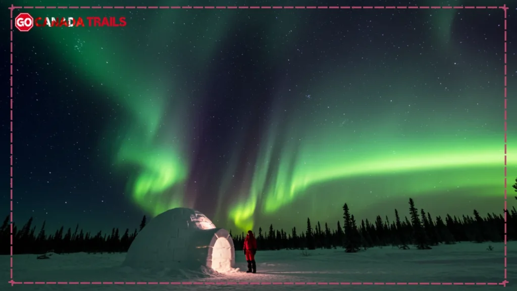 Panoramic winter scene in Yellowknife featuring an intense aurora display above a traditional igloo, with snowflakes in the air and a traveler in a red parka gazing upward.